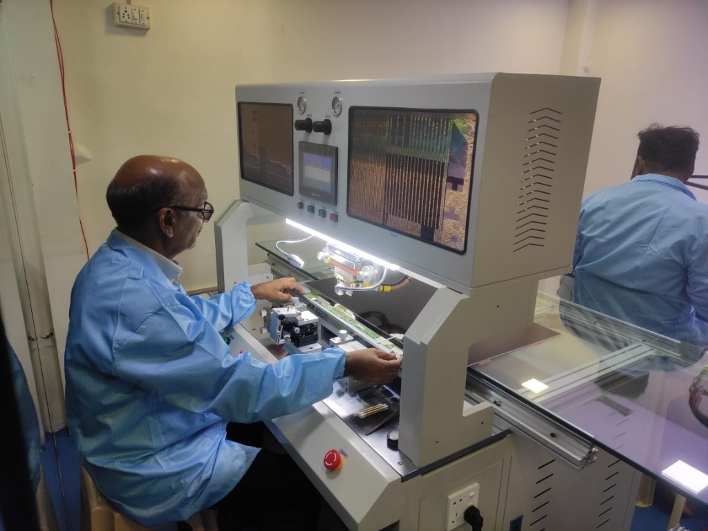 Technician working on TV panel diagnostics