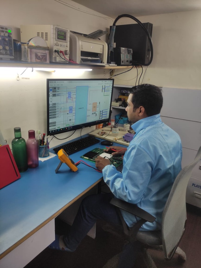 Technician diagnosing electronics with multimeter